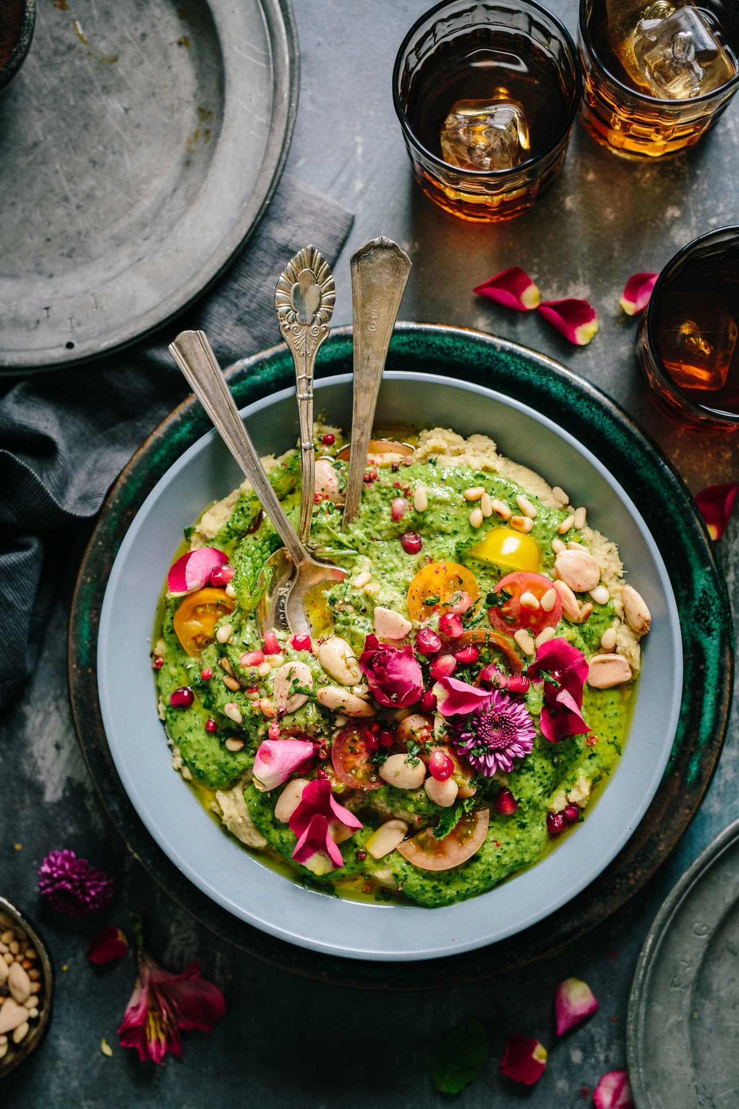 Colourful whole-food bowl with herbs and edible flowers